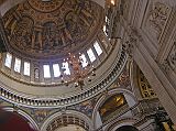 London St. Pauls Cathedral 07 Dome The St. Pauls Cathedral altar sits beneath Wrens great dome, which he conceived as an observatory linking heaven and earth. Statues portray doctors of both western and eastern churches. The Whispering Gallery is visible circling under the dome. We climbed 30m to the Whispering Gallery in St. Pauls Cathedral, where a whisper on one side can be heard 32m away on the other. The security guard was very diligent at not allowing any photos to be taken.